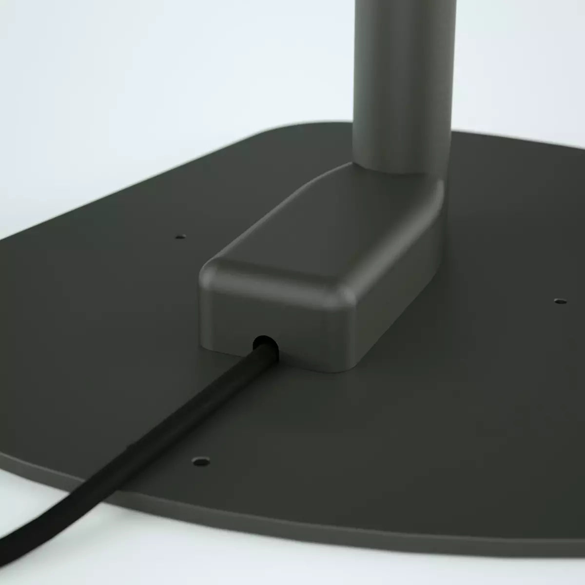 Close up of the black kiosk stand baseplate with the electrical cover hiding wiring..