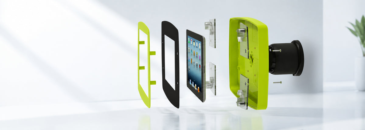 Exploded view of a lime green iPad enclosure showing the faceplate, fit kit, tablet, and mounting base
